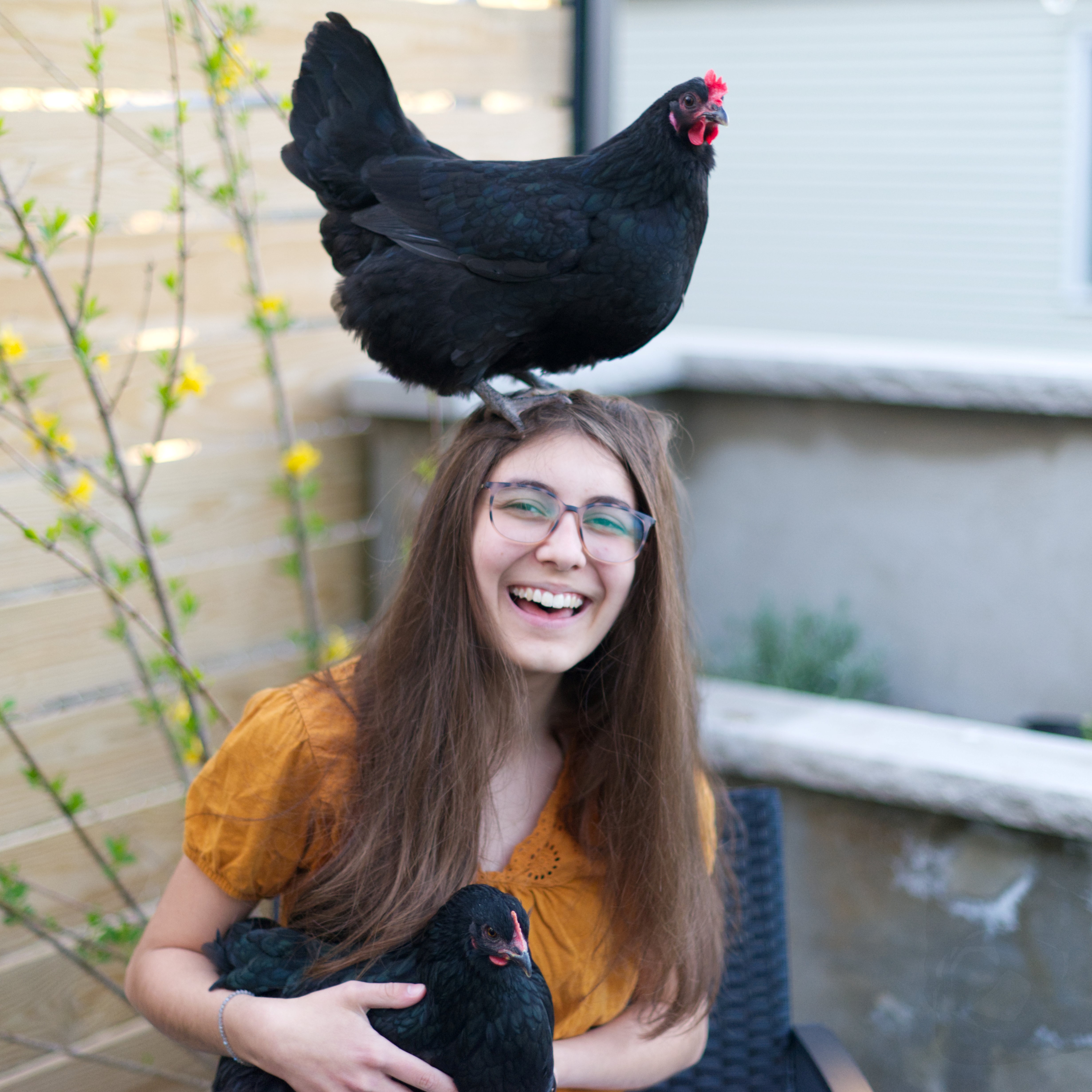 Ines holding her chickens.